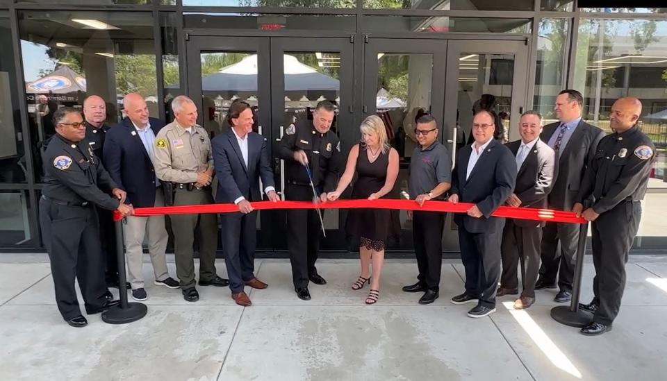 San Bernardino County Fire Chief Dan Munsey cuts the ribbon at the San Bernardino County Fire Protection District's new headquarters building on Wednesday, June 12, 2024.