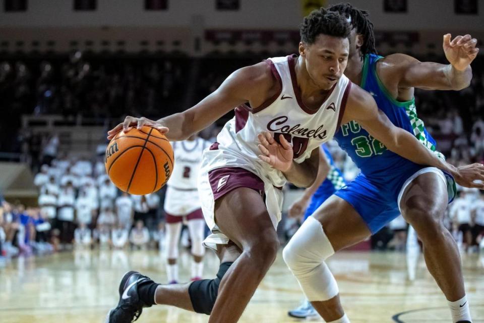 Eastern Kentucky’s Isaiah Cozart (50) drives against Florida Gulf Coast’s Keeshawn Kellman (32) in Richmond on Wednesday night. Cozart is averaging a double-double this season for EKU.