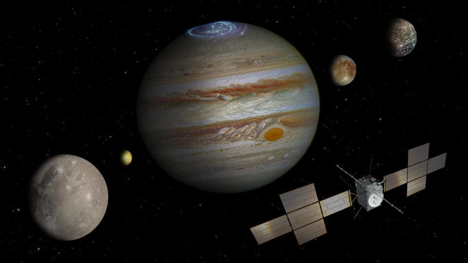 An artist's impression of ESA's Jupiter Icy Moons Explorer -- JUICE - in orbit around giant planet, flying past its largest moons (left to right): Ganymede, volcanic Io, Jupiter (with auroral display), Europa and Callisto. / Credit: ESA