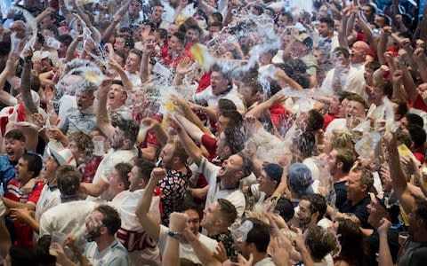 England fans celebrate as England score the second of their two goals against Sweden - Credit: Matt Cardy/Getty Images Europe