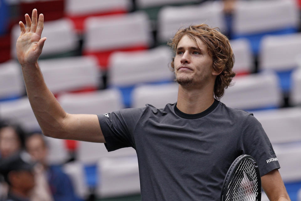 Alexander Zverev of Germany gestures to the spectators after winning his men's singles quarterfinals match against Kyle Edmund of Britain in the Shanghai Masters tennis tournament at Qizhong Forest Sports City Tennis Center in Shanghai, China, Friday, Oct. 12, 2018. (AP Photo/Andy Wong)