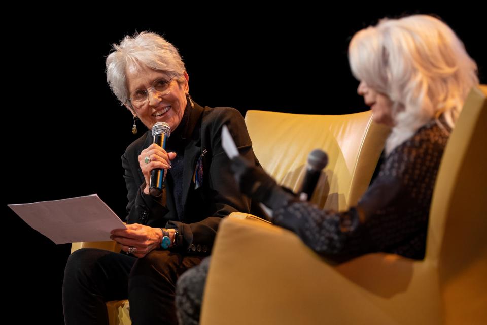 Joan Baez, left, speaks about new book of drawings, Am I Pretty When I Fly? An Album of Upside Down Drawings, with Emmylou Harris, right, at OZ Arts in Nashville, Tenn., Saturday, April 8, 2023.