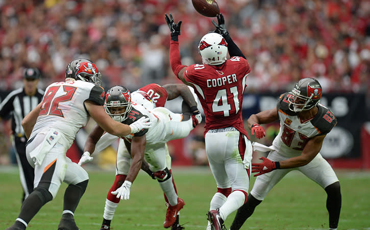 Sep 18, 2016; Glendale, AZ, USA; Arizona Cardinals defensive back Marcus Cooper (41) intercepts a pass and returns it for a touchdown against the Tampa Bay Buccaneers during the second half at University of Phoenix Stadium.
