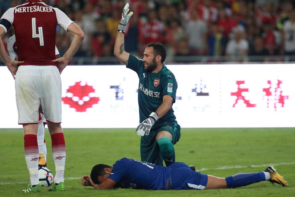 Clash: Pedro lies injured after colliding with Ospina: EPA