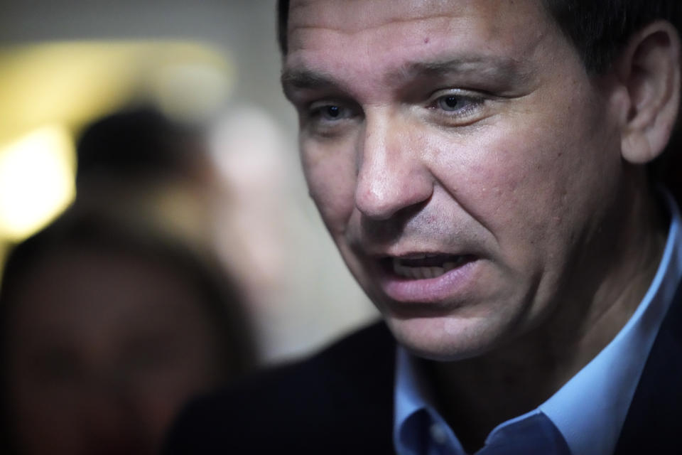 Florida Gov. Ron DeSantis speaks with a customer at the Red Arrow Diner during a visit to Manchester, N.H., Friday, May 19, 2023. (AP Photo/Robert F. Bukaty)