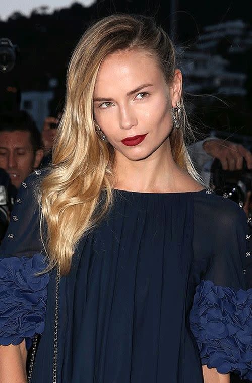 The golden goddess on the carpet at the Chanel and Vanity Fair party in Cannes looked gorgeous. Her deep red matte lips were a showstopper, as was her silky side swooshed do. Her natural toned make up is clean and simple, allowing those lips to radiate against her elegant navy frock.