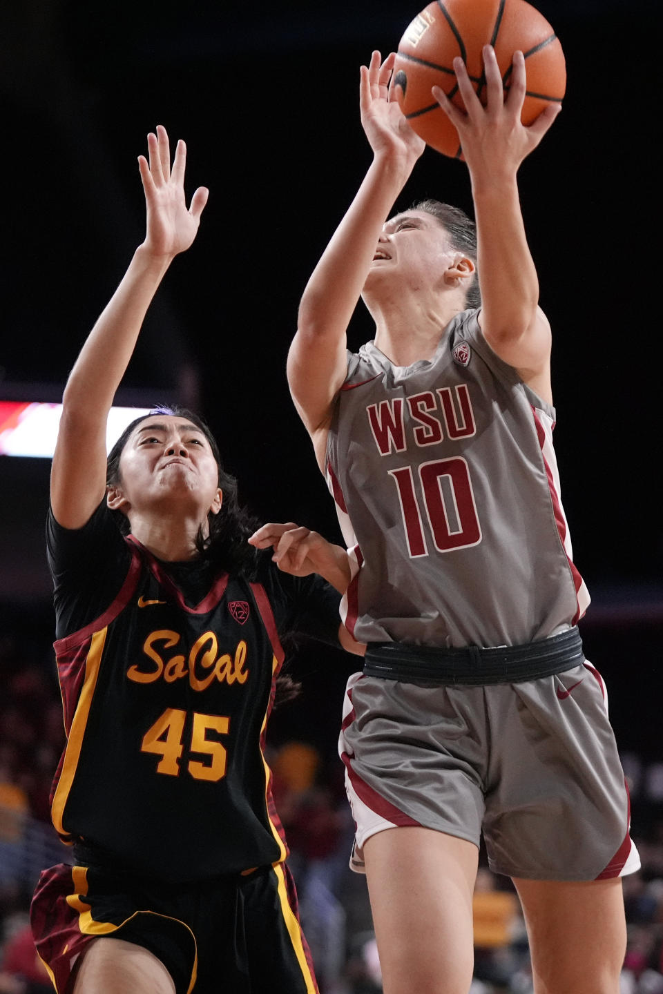 Washington State guard Eleonora Villa, right, shoots as Southern California guard Kayla Padilla defends during the first half of an NCAA college basketball game Friday, Jan. 26, 2024, in Los Angeles. (AP Photo/Mark J. Terrill)