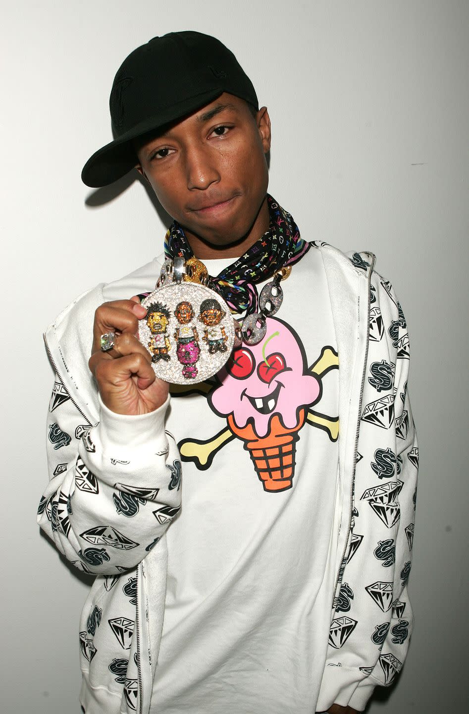 <p>Coco Chanel suggested you remove one accessory from your outfit before leaving your home each morning. These are wise words, Pharrell. </p>