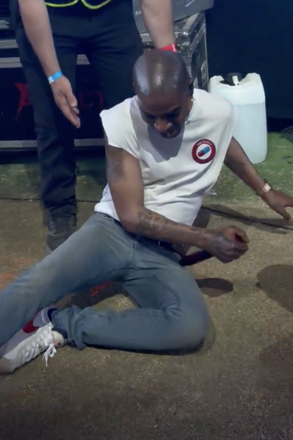 Screenshot of Kid Cudi on the ground at Coachella