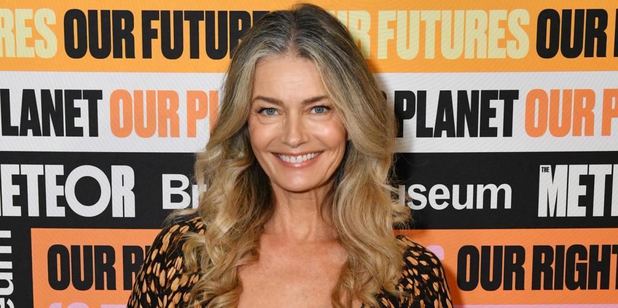 paulina porizkova wears brown and black spotted dress smiling at meteor meet the moment summit