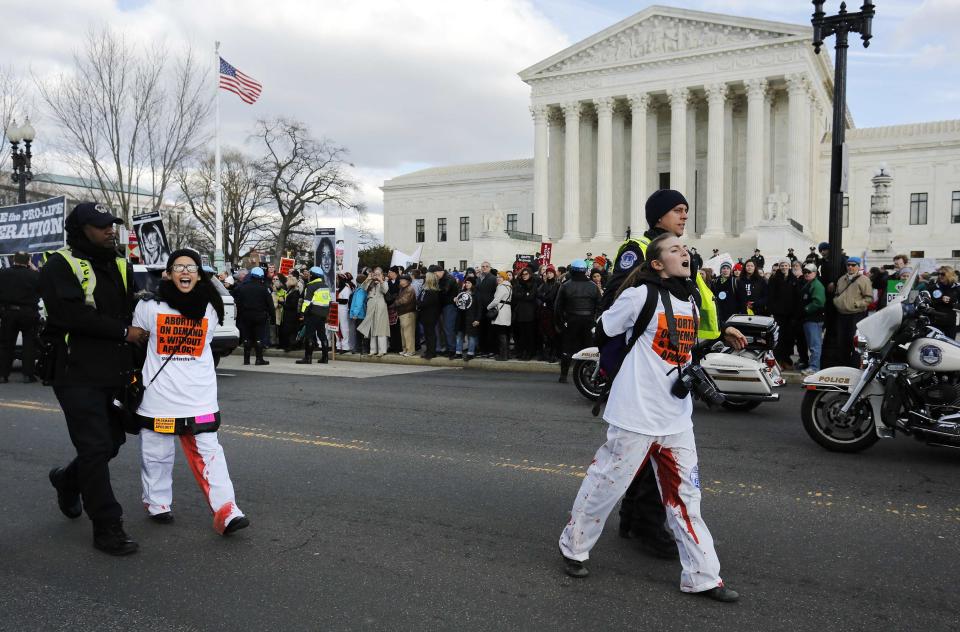 U.S. Capitol Police arrest pro-choice protesters for blocking way of anti-abortion March for Life at U.S. Supreme Court building in Washington