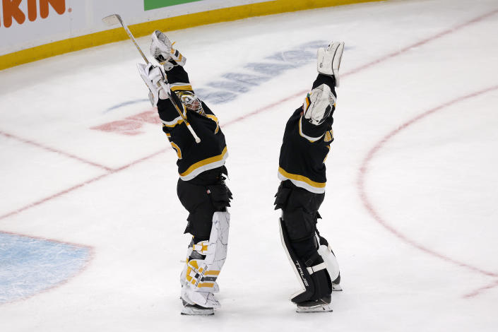 Boston Bruins goaltender Linus Ullmark, left, celebrates with goalie Jeremy Swayman after defeating the Detroit Red Wings 3-2 in an NHL hockey game, Saturday, March 11, 2023, in Boston. (AP Photo/Mary Schwalm)