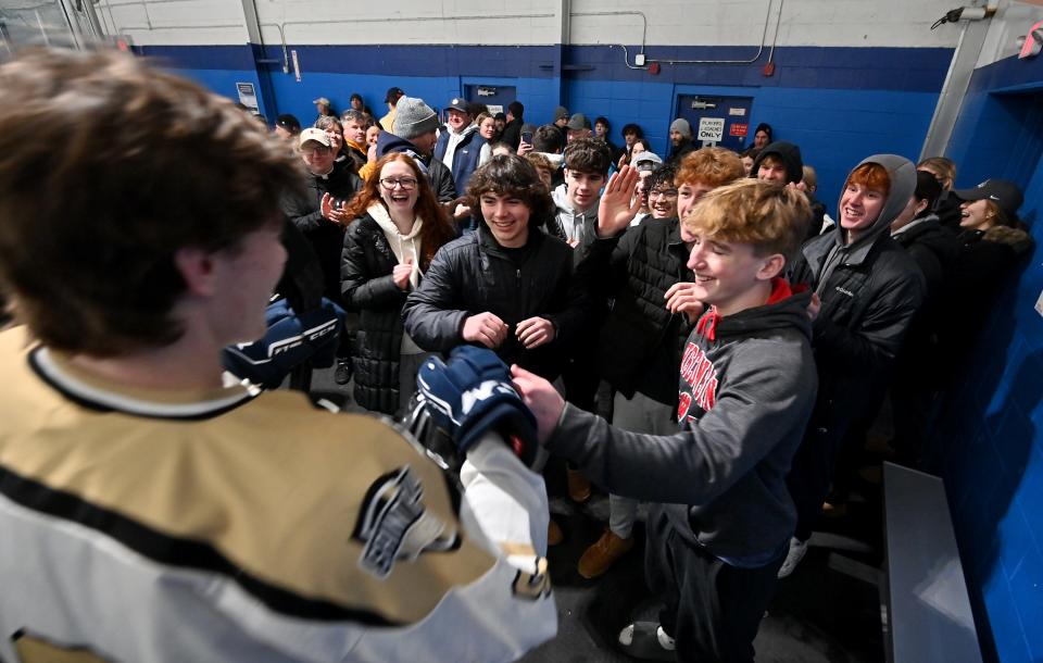 WESTBOROUGH - St. Paul junior captain Colin Kreuz is congratulated by fans and friends as he leaves the skating surface at NorthStar Ice Sports following his team's 3-1 win over Marlborough.