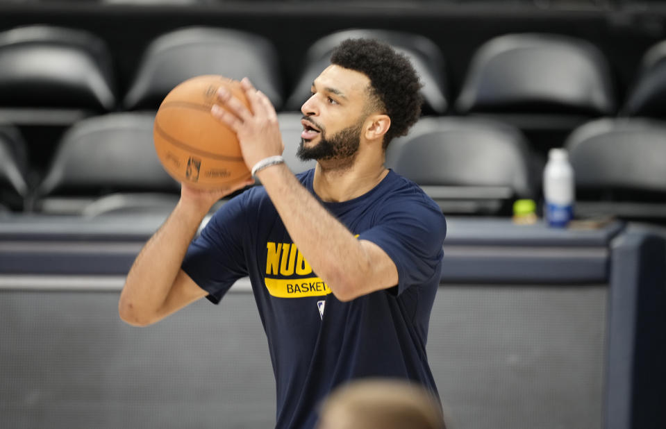 Denver Nuggets guard Jamal Murray warms up during practice for Game 2 of the NBA Finals Saturday, June 3, 2023, in Denver. (AP Photo/David Zalubowski)