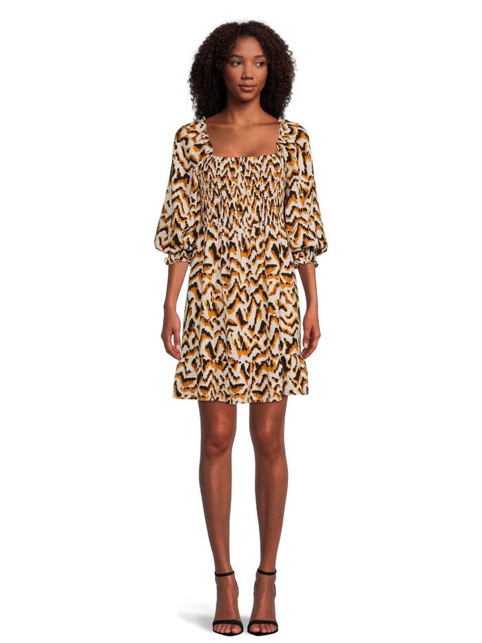 Model wearing the feline print dress