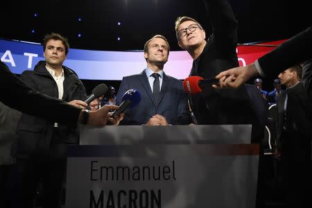 Emmanuel Macron of the political movement En Marche ! (Onwards !) arrives at the television studio where the eleven candidates will attend a prime-time televised debate for the French 2017 presidential election in La Plaine Saint-Denis, near Paris, France, April 4, 2017. REUTERS/Lionel Bonaventure/Pool