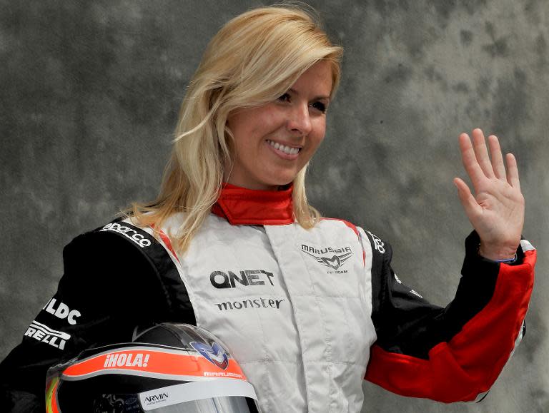 A picture taken on March 15, 2012 shows former Spanish Formula One driver Maria de Villota smiling and waving to photographers ahead of Formula One's Australian Grand Prix in Melbourne