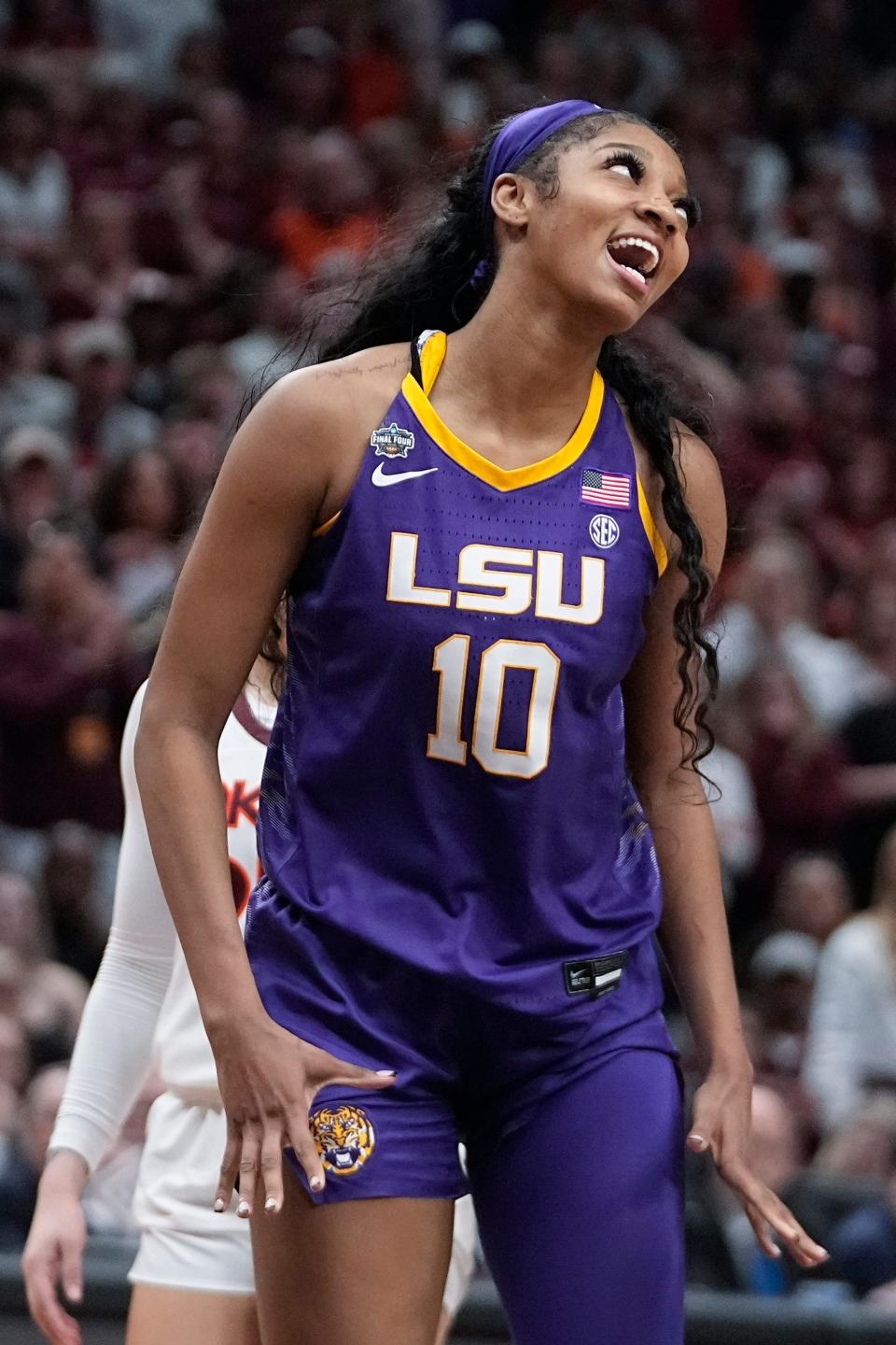 LSU's Angel Reese reacts during the second half of an NCAA Women's Final Four semifinals basketball game against Virginia Tech Friday, March 31, 2023, in Dallas. (AP Photo/Darron Cummings)