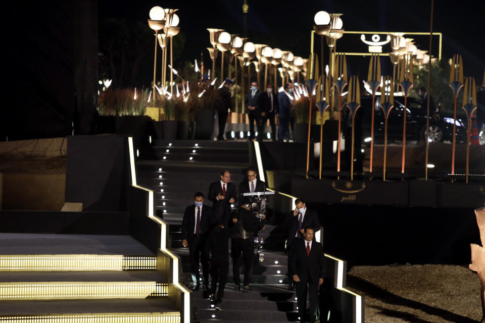 Egypt's President Abdel Fattah al-Sisi and Tourism and Antiquities Minister Khaled el-Enany attend the reopening ceremony of the Avenue of Sphinxes commonly known as El Kebbash Road on Thursday, Nov. 25, 2021 in Luxor, Egypt. The ceremony was meant to highlight the country’s archaeological treasures as Egypt struggles to revive its tourism industry, battered by years of political turmoil and more lately, the coronavirus pandemic. (AP Photo/Mohamed El-Shahed)