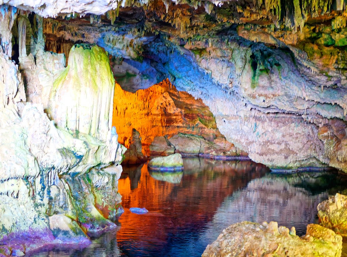 The colours of Neptune’s Grotto in Sardinia leave a lasting impact (Getty Images/iStockphoto)
