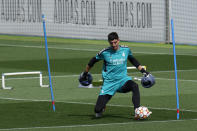 Real Madrid's goalkeeper Thibaut Courtois trains during a Media Opining day training session in Madrid, Spain, Tuesday, May 24, 2022. Real Madrid will play Liverpool in Saturday's Champions League soccer final in Paris. (AP Photo/Manu Fernandez)