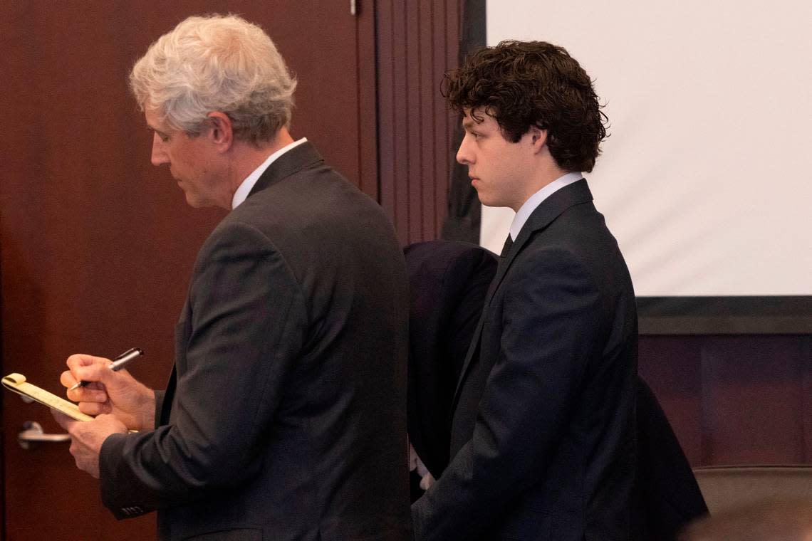 Landen Glass, right stands in court with his attorneys Robert Smith Jr., left, and Russell Babb during a March 29, 2023, bond hearing at the Wake County Justice Center in Raleigh. Glass is the driver who lost control of his truck and struck and killed an 11-year-old girl in the Raleigh Christmas parade. He faces felony involuntary manslaughter charge.