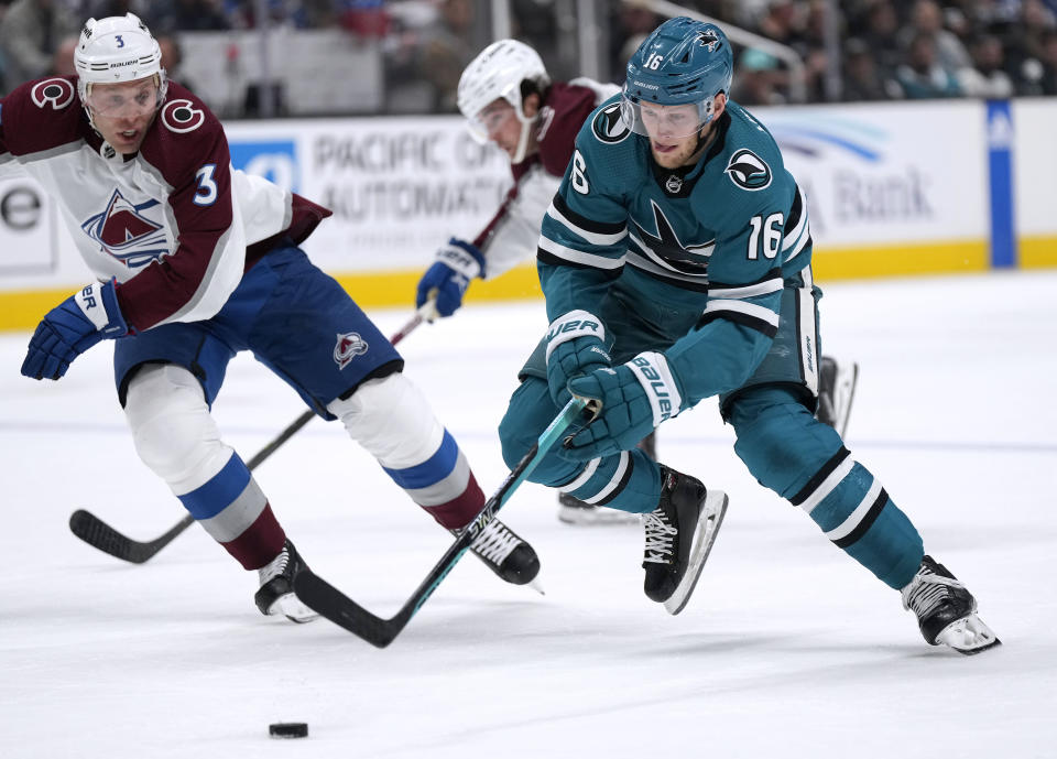 San Jose Sharks center Steven Lorentz (16) moves the puck up the ice past Colorado Avalanche defenseman Jack Johnson (3) during the first period of an NHL hockey game Tuesday, April 4, 2023, in San Jose, Calif. (AP Photo/Tony Avelar)