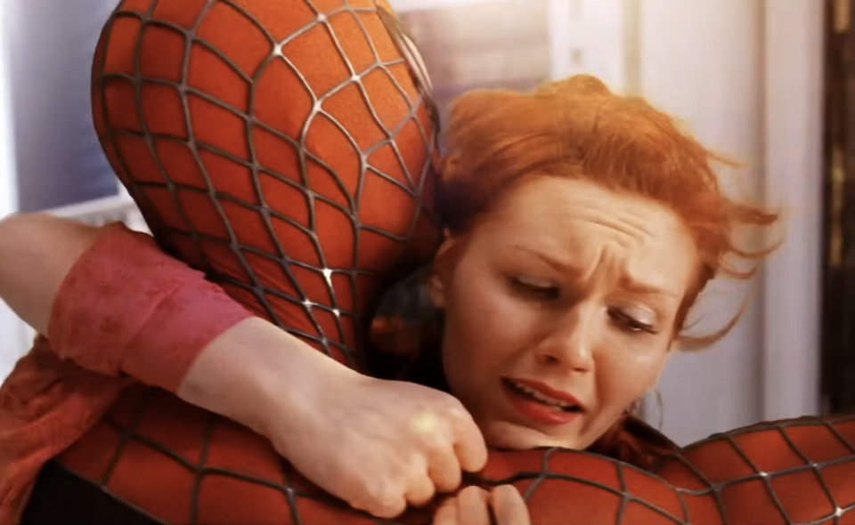 Tobey Maguire as Spider-Man holds Kirsten Dunst in a dramatic scene from the "Spider-Man" (2002) trailer