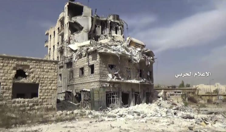 Still image taken from video provided by the Syrian government-controlled Syrian Central Military Media, damaged buildings inside Aleppo, Syria, on Tuesday, Oct. 4, 2016. (Syrian Central Military Media via AP)