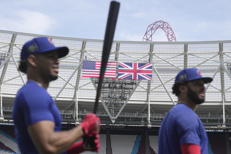 Chicago Cubs' team players practice during a training session ahead of the baseball match against St. Louis Cardinals at the MLB World Tour London Series, in London Stadium. (AP Photo/Kin Cheung)