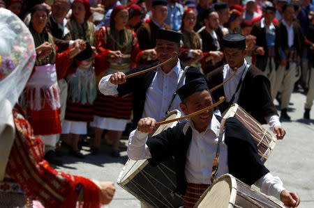 People dressed in folk costumes take part in a traditional wedding ceremony in the village of Galicnik, west of capital Skopje, Macedonia July 15, 2018. REUTERS/Ognen Teofilovski