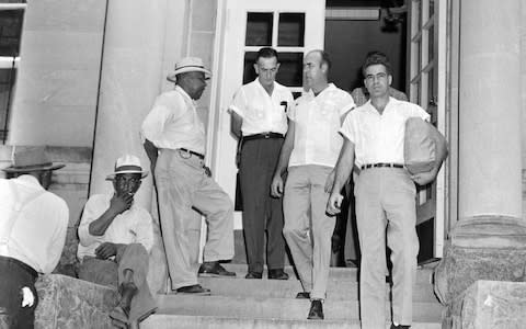 Roy Bryant, right, and JW Milam, second from right, leave a courthouse in Mississippi, in 1955 after being freed on bond - Credit: AP
