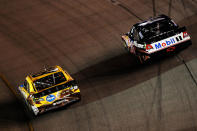 RICHMOND, VA - APRIL 28: Kyle Busch, driver of the #18 M&M's Ms. Brown Toyota, races Tony Stewart, driver of the #14 Mobil 1/Office Depot Chevrolet, side by side during the NASCAR Sprint Cup Series Capital City 400 at Richmond International Raceway on April 28, 2012 in Richmond, Virginia. (Photo by Todd Warshaw/Getty Images for NASCAR)