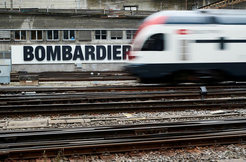 FILE PHOTO: A Bombardier advertising board is pictured in front of a SBB CFF Swiss railway train at the station in Bern