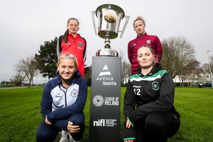 Avenir Sports All-Island Cup Launch at FAI HQ in March with Bohemian's Aoibhe Brennan, Shelbourne's Lucy O'Rourke, Peamount United's Louis Masterson and Galway United's Lynsey McKey with four ladies and big silver cup on podium at centre