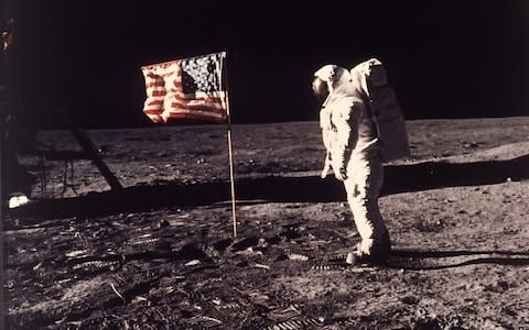 This July 20, 1969 file photo released by NASA shows astronaut Edwin E. "Buzz" Aldrin Jr. posing for a photograph beside the U.S. flag on the moon - Credit: NASA