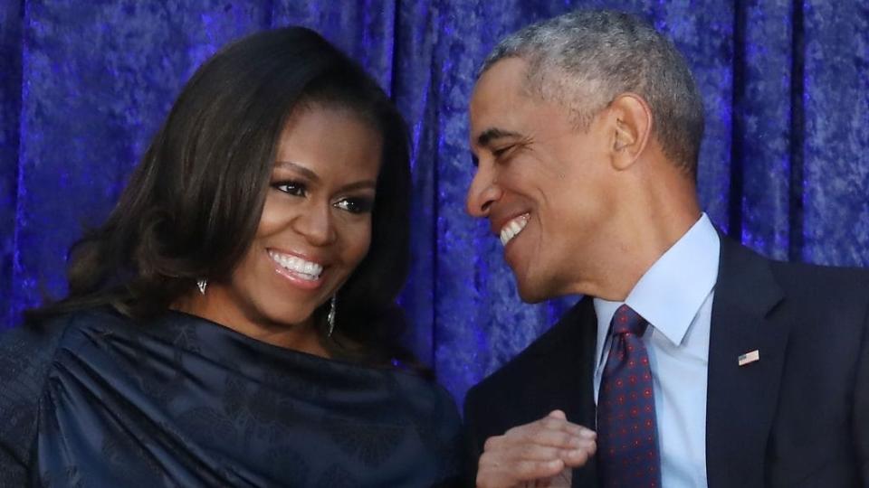 In this 2018 photo, former First Lady Michelle Obama and former President Barack Obama share a smile at the unveiling of their official portraits at the Smithsonian’s National Portrait Gallery in Washington, D.C. (Photo by Mark Wilson/Getty Images)