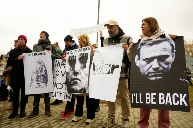 Late Russian opposition leader Alexei Navalny's supporters stage a protest at the front of the Russian Embassy in Riga