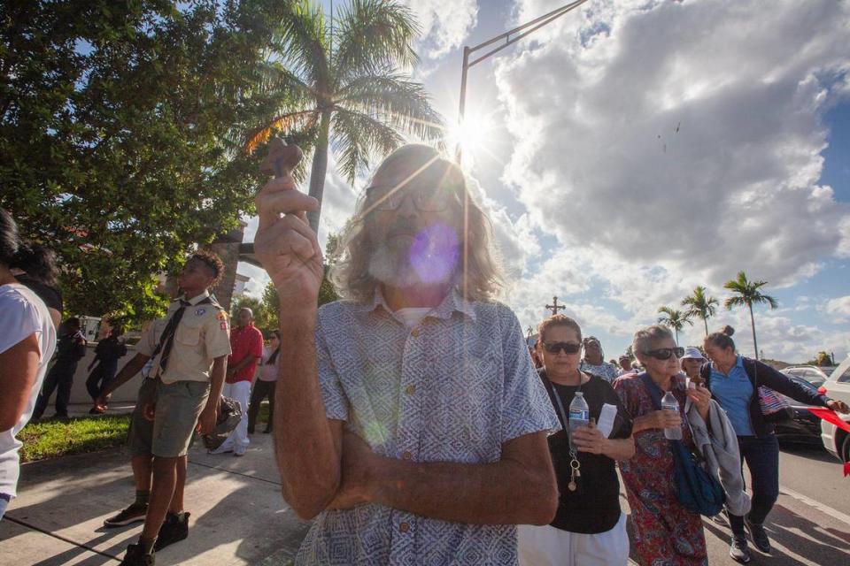 Julio Dávila walks in the procession when Archbishop Wenski celebrates the Liturgy of the Lord’s Passion, the Veneration of the Cross procession at The Cathedral of St. Mary, in Miami on Friday March 29th., 2024.