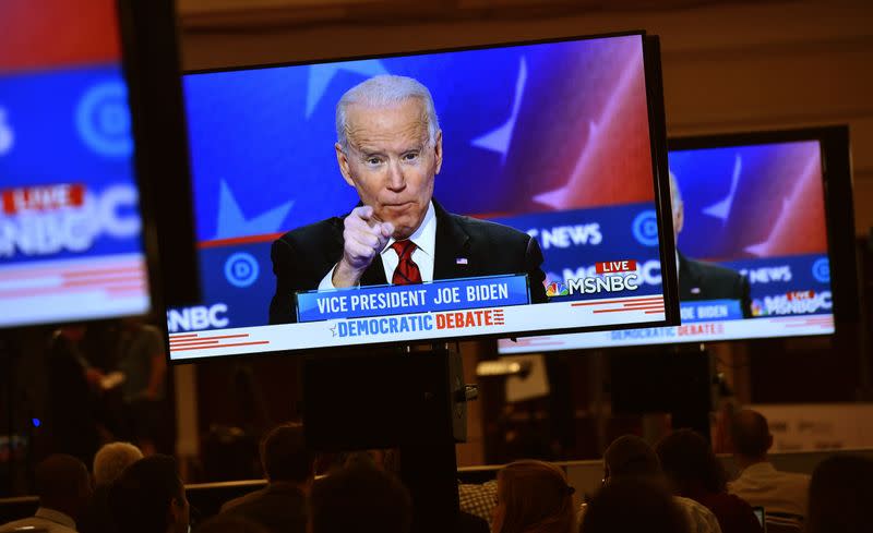 Former Vice President Joe Biden is seen speaking on a live video feed in the media filing center during the ninth Democratic 2020 U.S. Presidential candidates debate at the Paris Theater in Las Vegas