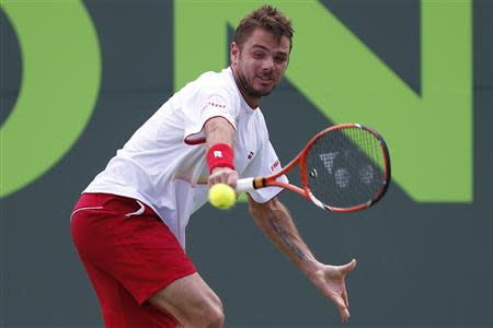 Stanislas Wawrinka hits a backhand against Daniel Gimeno-Traver (not pictured) on day six of the Sony Open at Crandon Tennis Center. Mandatory Credit: Geoff Burke-USA TODAY Sports