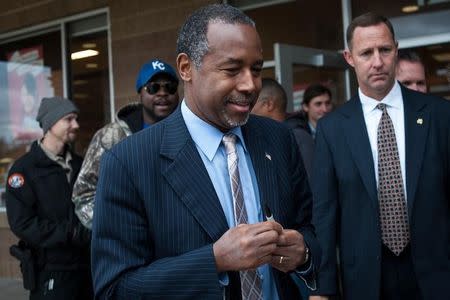 Republican presidential candidate Dr. Ben Carson leaves a book signing and campaign event in Ames, Iowa on October 24, 2015. REUTERS/Mark Kauzlarich