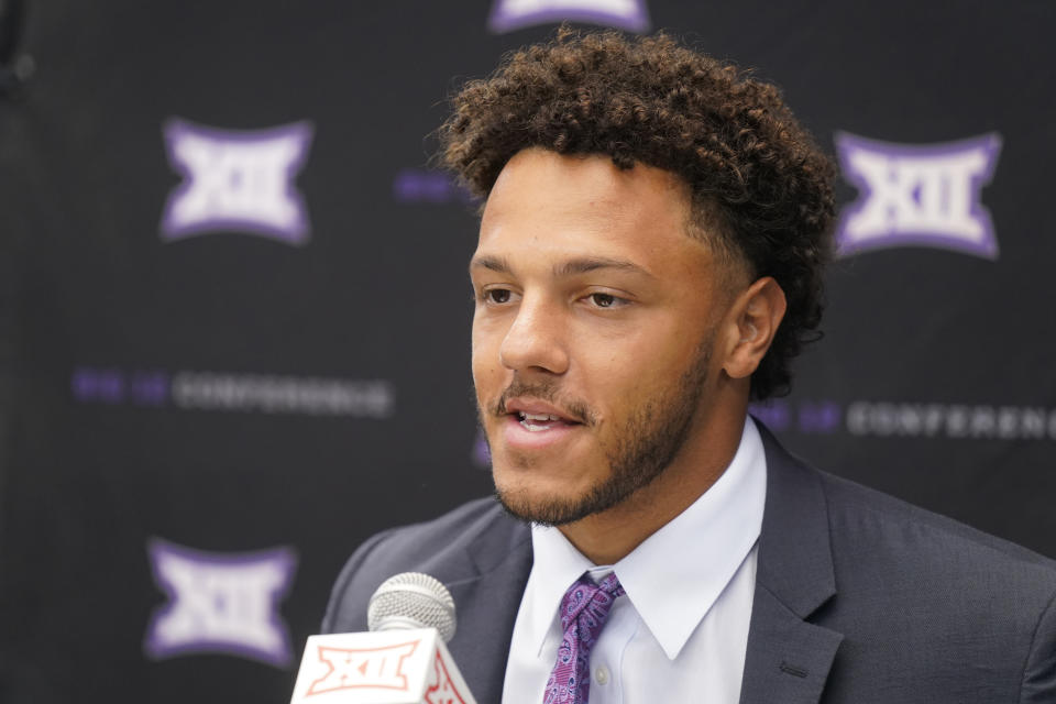 FILE - Kansas State quarterback Adrian Martinez speaks to reporters during the NCAA college football Big 12 Media Days in Arlington, Texas, Wednesday, July 13, 2022. Kansas State is set to kick off its season on Sept. 3, 2022, against South Dakota. (AP Photo/LM Otero, File)