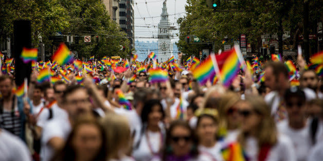 SAN FRANCISCO, CA- JUNE 28: San Francisco's Ferry Builiding is seen behind marchers in the San Francisco Gay Pride Parade, June 28, 2015 in San Francisco, California. The 2015 pride parade comes two days after the U.S. Supreme Court's landmark decision to legalize same-sex marriage in all 50 states. (Photo by Max Whittaker/Getty Images) (Photo: )