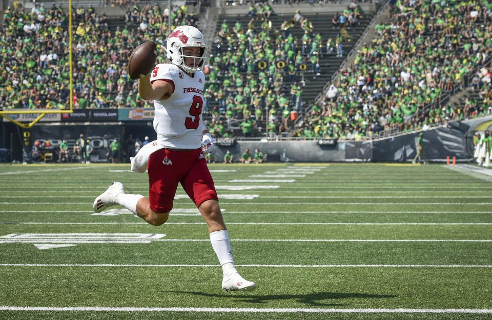 Fresno State quarterback Jake Haener (9) scores during the third quarter of an NCAA college football game against Oregon, Saturday, Sept. 4, 2021, in Eugene, Ore. (AP Photo/Andy Nelson)