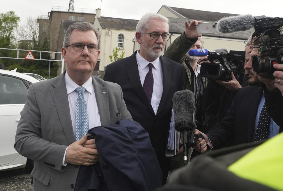 Former DUP leader Sir Jeffrey Donaldson, left, arrives at Newry Magistrates' Court, where he is charged with several historical sexual offences, in Newry, Northern Ireland, Wednesday April 24, 2024. Sir Jeffrey resigned as DUP leader and was suspended from the party following the charges. (Niall Carson/PA via AP)