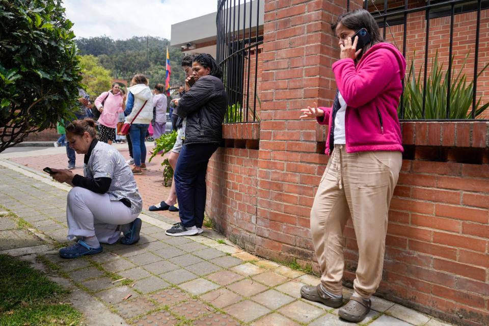 Residents gather outside their homes after a quake was felt in Bogota, Colombia, Thursday, Aug. 17, 2023. A magnitude 6.3 earthquake shook Colombia's capital and other major cities on Thursday, according to reports by United States Geological service. USGS reported a second 5.7 magnitude quake shortly after the first.