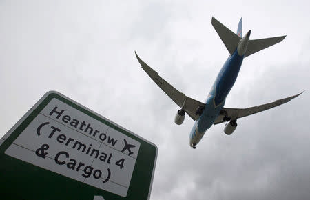 FILE PHOTO: An aircraft lands at Heathrow Airport near London, Britain, December 11, 2015. REUTERS/Neil Hall/File Photo