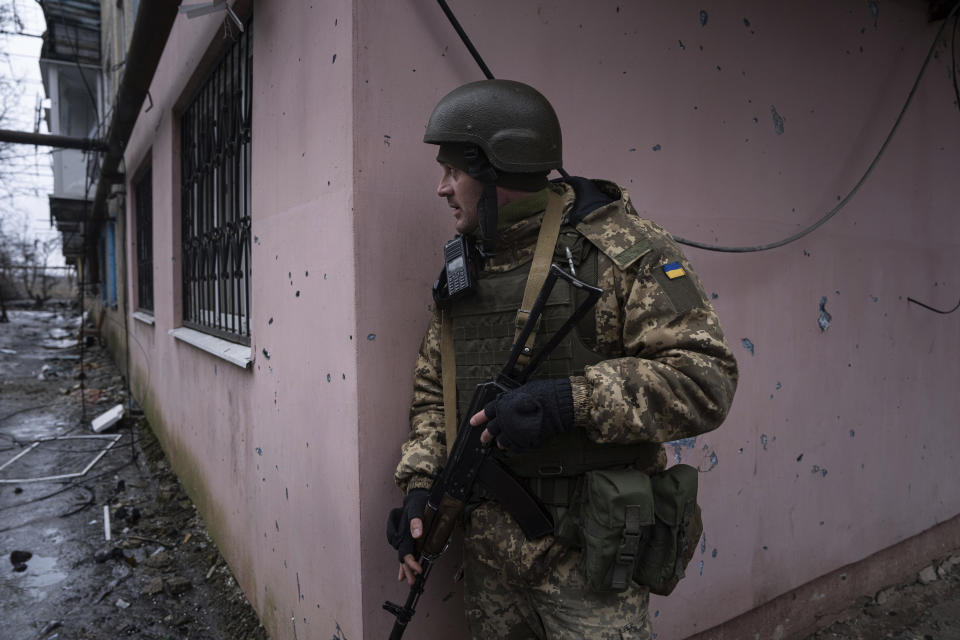 A Ukrainian marine serviceman prepares to change position during a patrol in the frontline city of Vuhledar, Ukraine, Saturday, Feb. 25, 2023. (AP Photo/Evgeniy Maloletka)