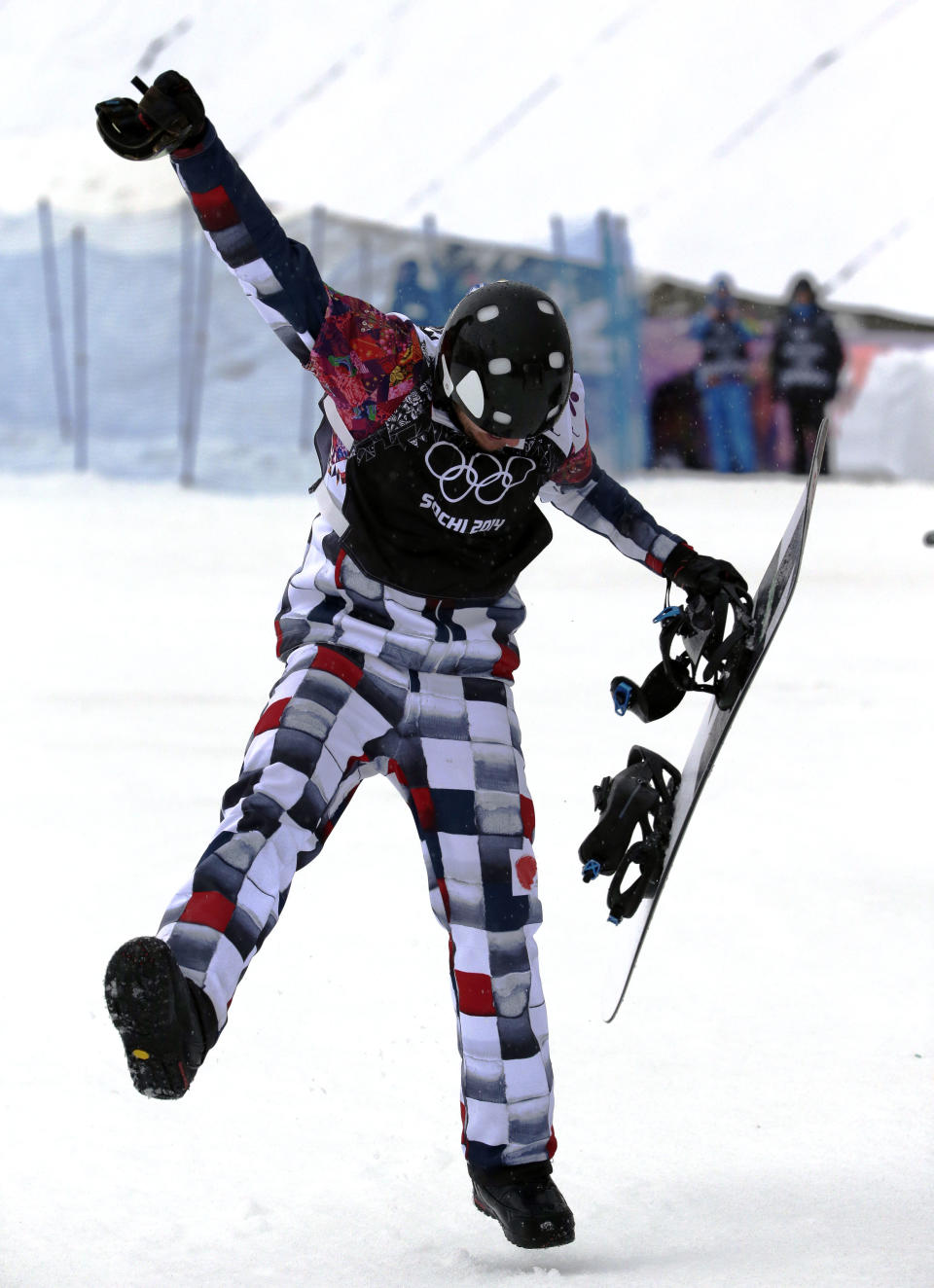 Russia's Nikolai Olyunin dances after winning the men's snowboard cross semifinal at the Rosa Khutor Extreme Park, at the 2014 Winter Olympics, Tuesday, Feb. 18, 2014, in Krasnaya Polyana, Russia. (AP Photo/Andy Wong)